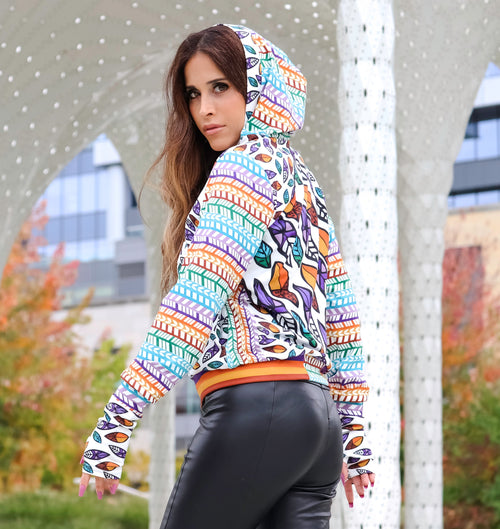 A Peruvian female model showing the side of the Summer Breeze Hooded Graphic Jacket | Peruvian Graphic Jacket