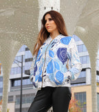 A Peruvian female model showing the front of the Azure Blooms Collared Graphic Jacket | Peruvian Graphic Jacket