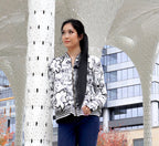 A Peruvian female model showing the front of the Monochrome Lily Collared Graphic Jacket | Peruvian Graphic Jacket