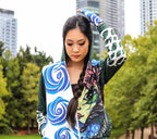 A Peruvian female model showing the front of the Enchanted Forest Hooded Graphic Jacket | Peruvian Graphic Jacket