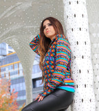 Peruvian female model showing the front of the Autumn Mirage Hooded Graphic Jacket | Peruvian Graphic Jacket